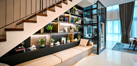 design idea for a living room using space saving bookshelves under the staircase