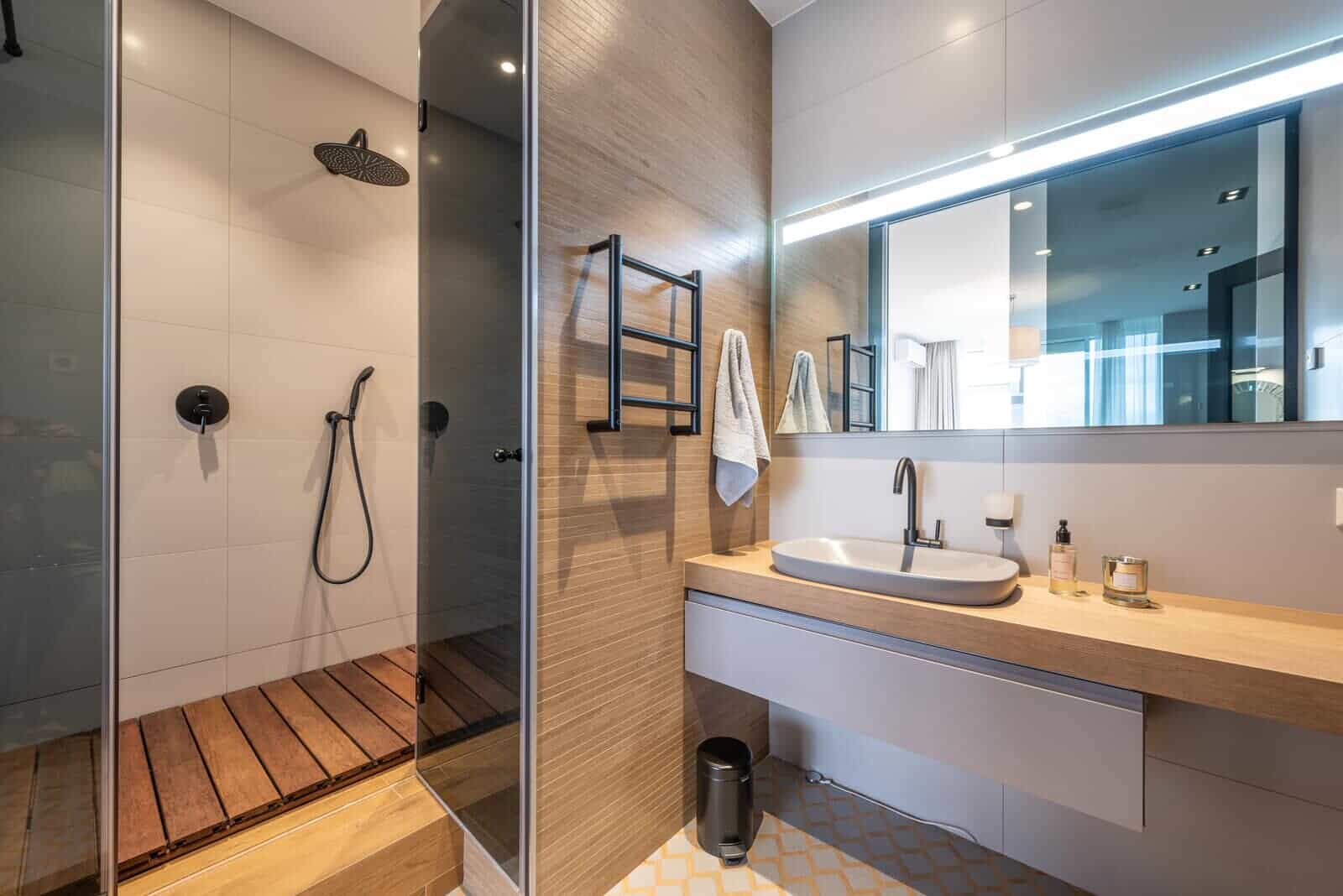 Bathroom design| small condo interior design ideas| condo interior designer| condo solutions| dark colors| walls ceiling| modern display| features|